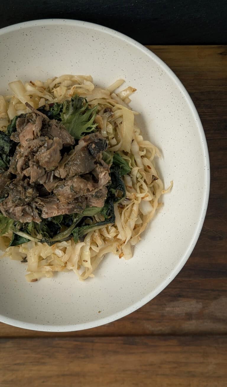 Slow-Roasted Lamb Shoulder with Spring Greens & Braised Cabbage
